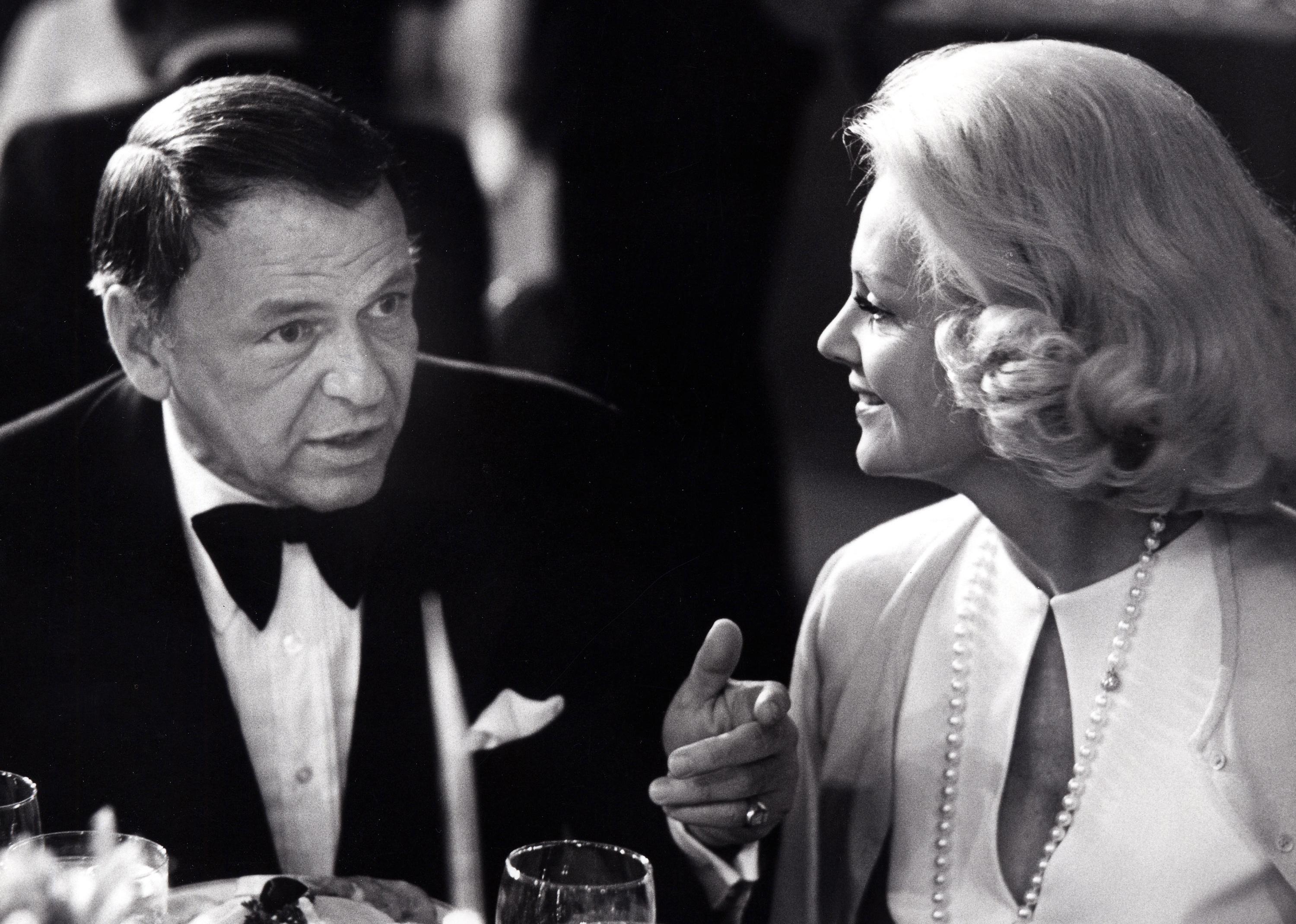Frank Sinatra and Barbara Marx at a dinner.