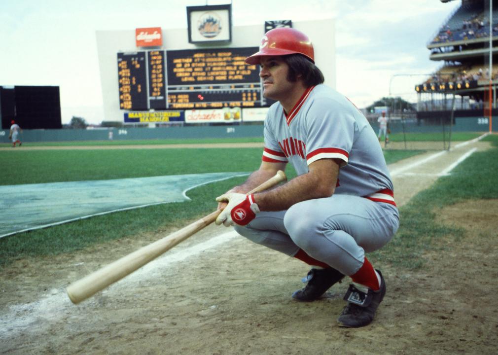 Pete Rose of the Cincinnati Reds crouches on the field before a game.