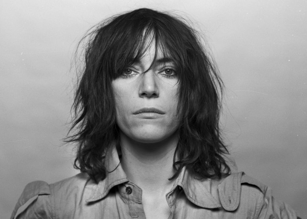 Still portrait of Patti Smith in black-and-white.