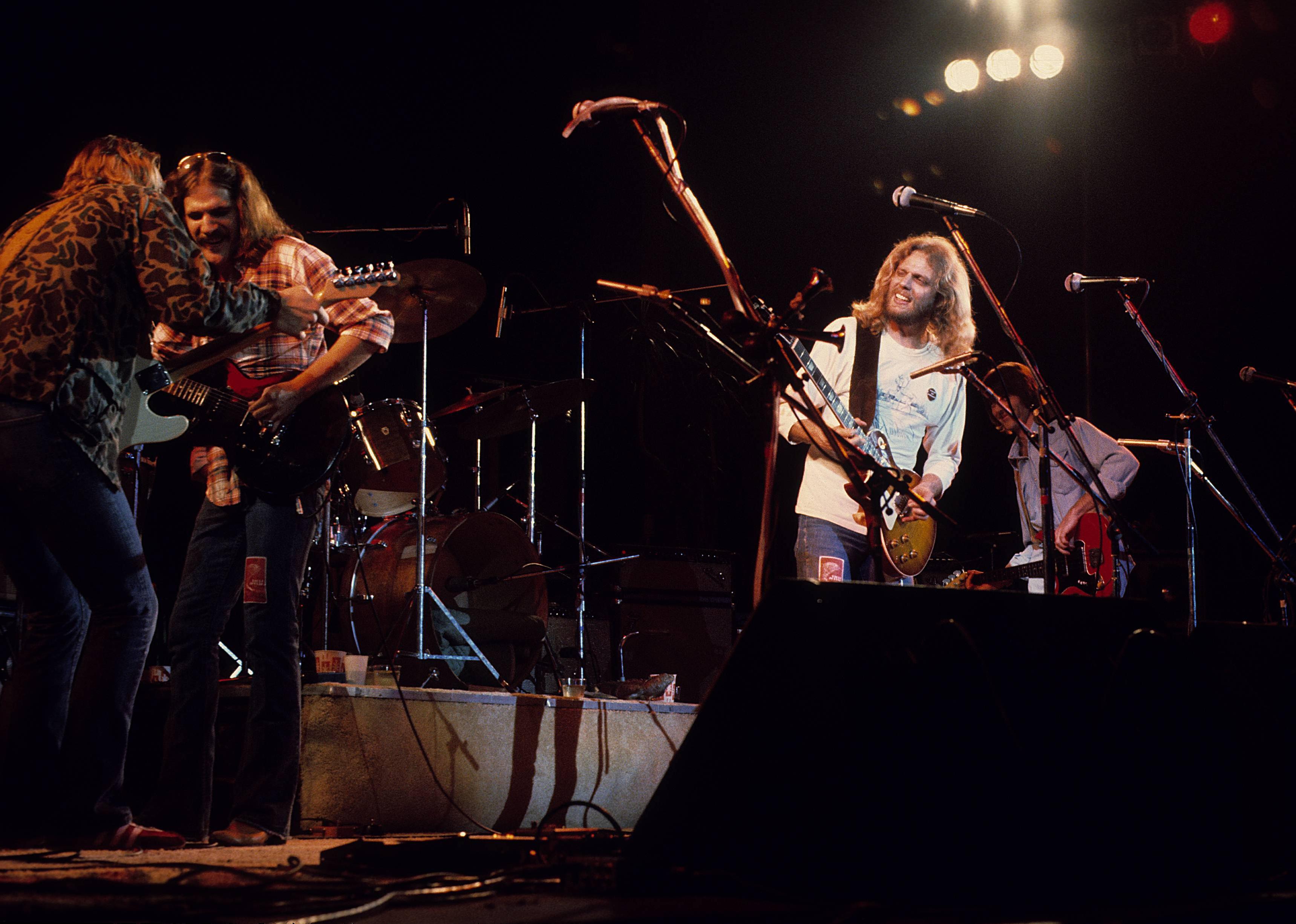 Joe Walsh, Glenn Frey, Don Felder and Randy Meisner performing on stage.