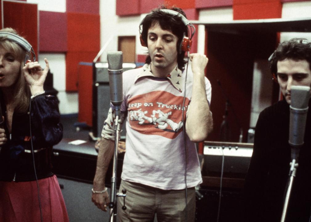 Paul McCartney and Linda McCartney with Denny Laine of Wings at a recording studio.