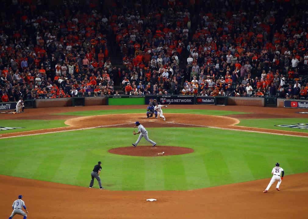 Alex Bregman of the Houston Astros hits a single during game five of the 2017 World Series.