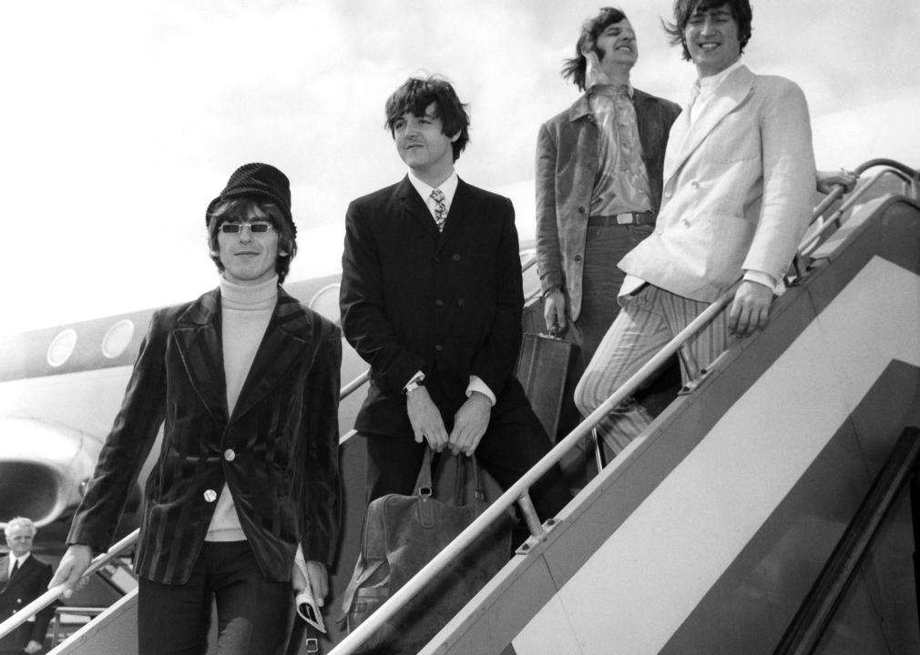 The Beatles as they pose on an airstair at Heathrow airport.