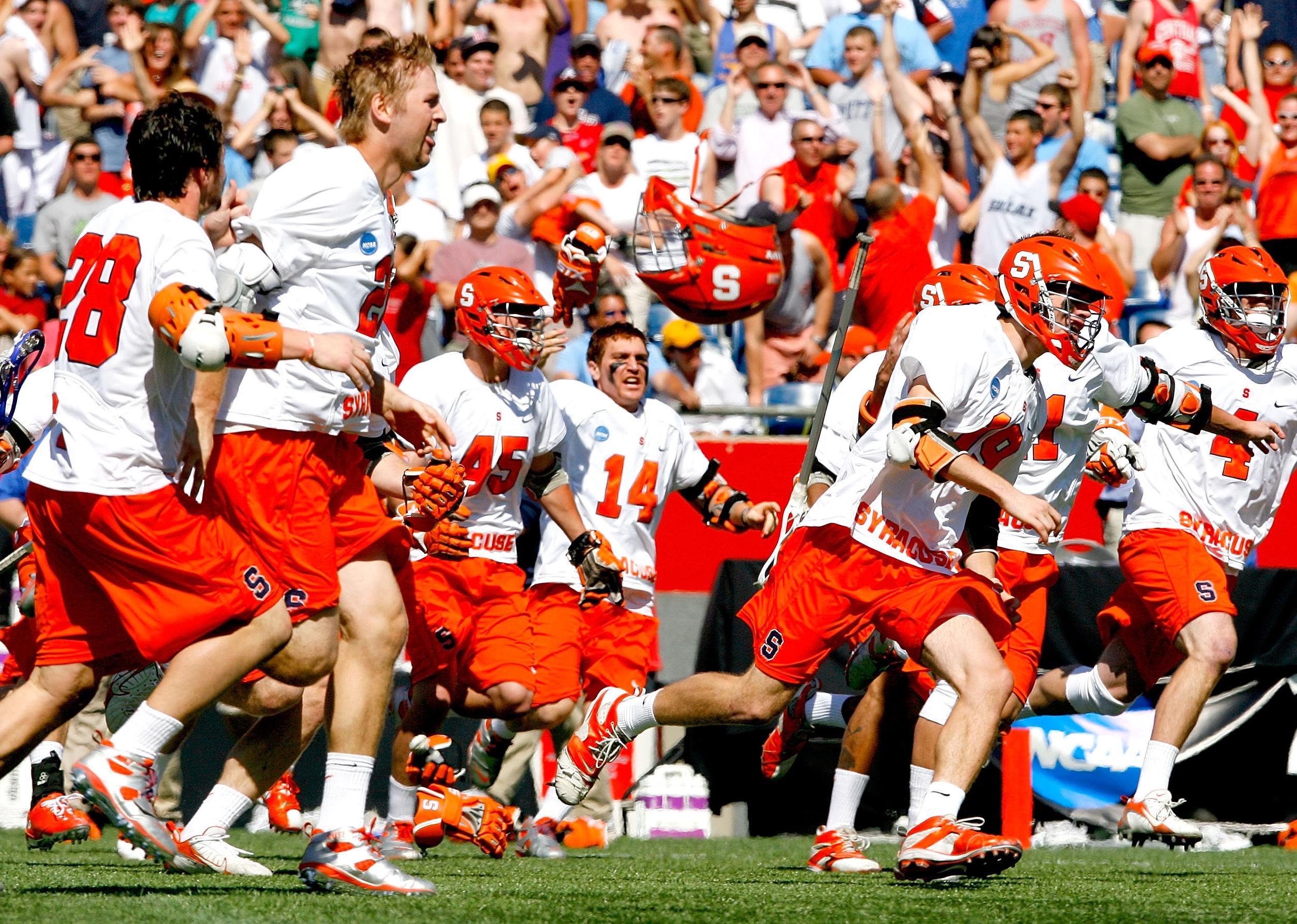 Syracuse Orange celebrates after defeating the Cornell Big Red.