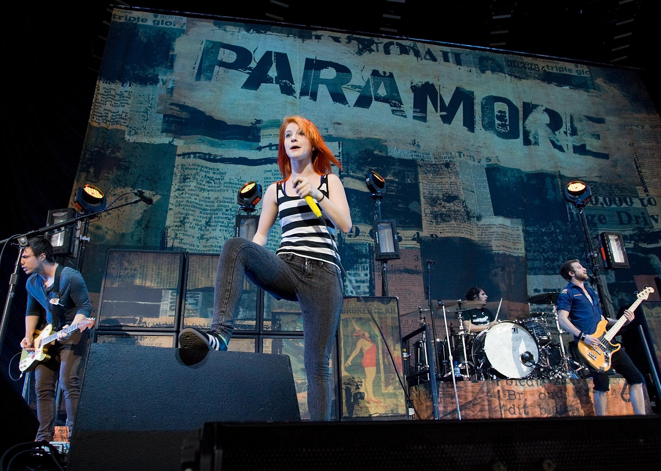 Josh Farro, Hayley Williams, Zac Farro, and Jeremy Davis of Paramore perform in concert.
