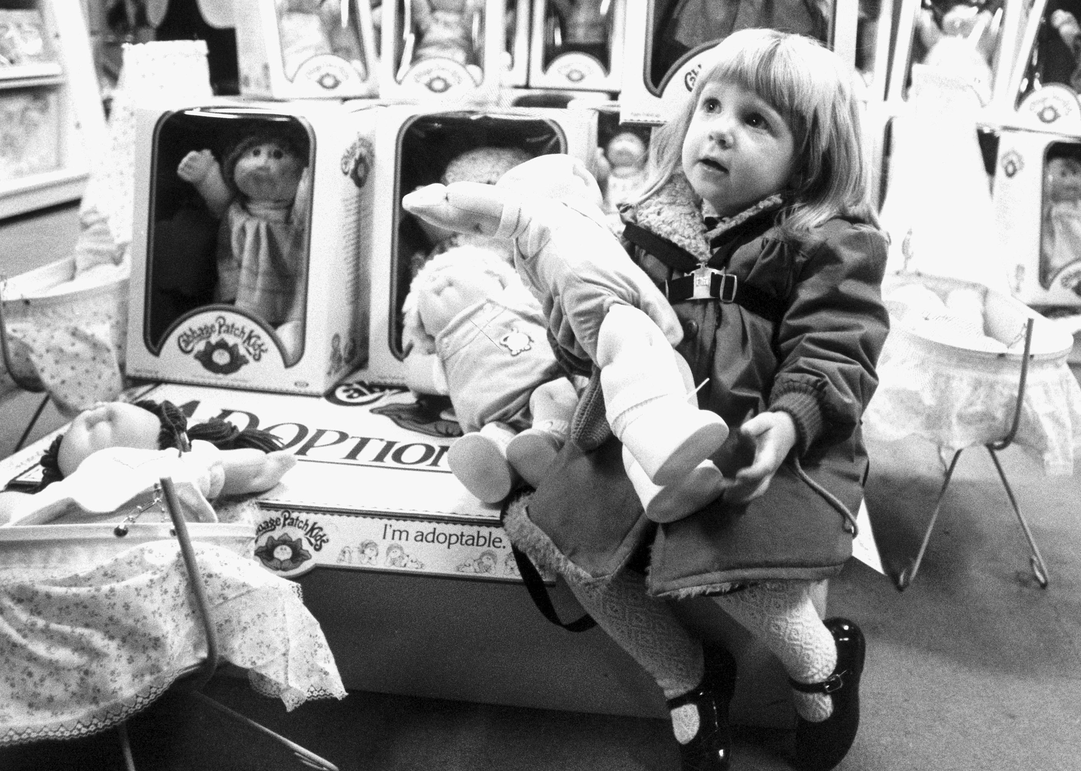 Little girl with a Cabbage Patch Kid.