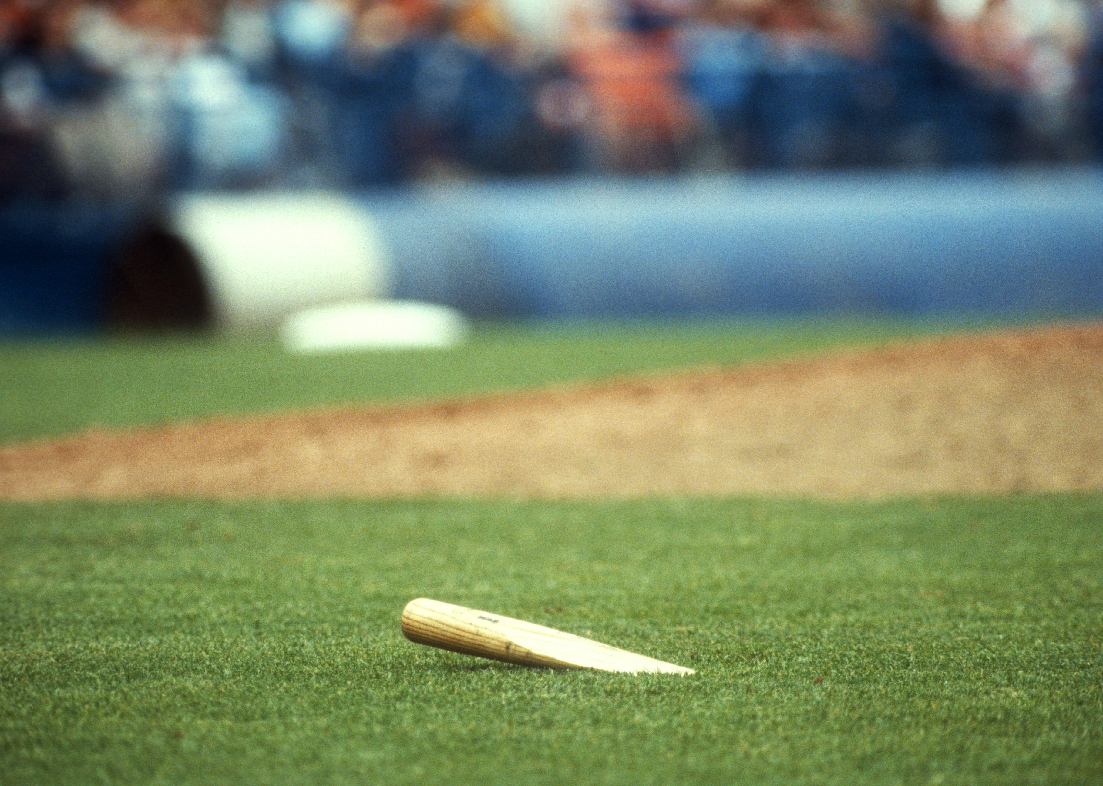 General view of a broken bat during an MLB game.