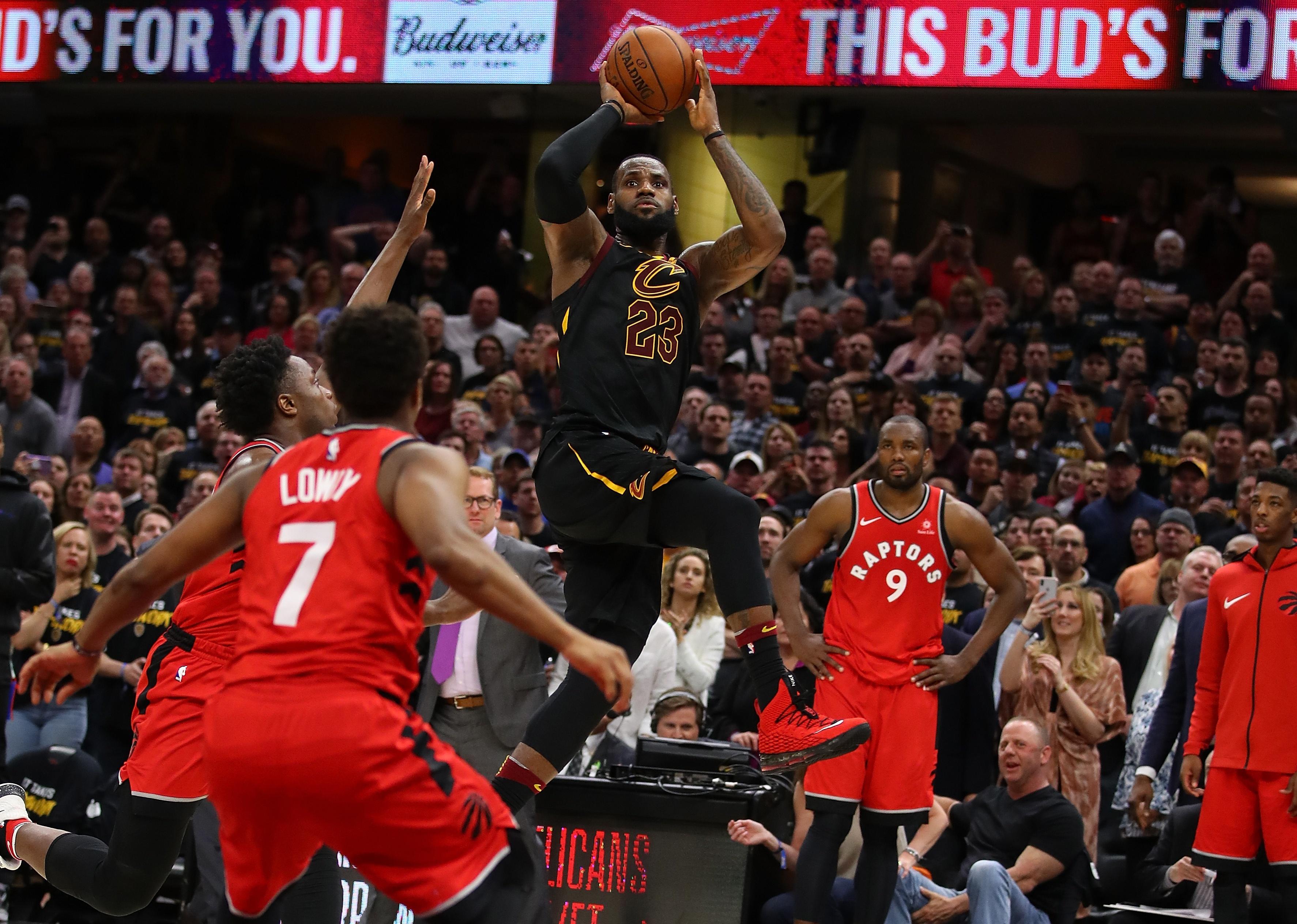 LeBron James of the Cleveland Cavaliers hits the game-winning shot over the Toronto Raptors.