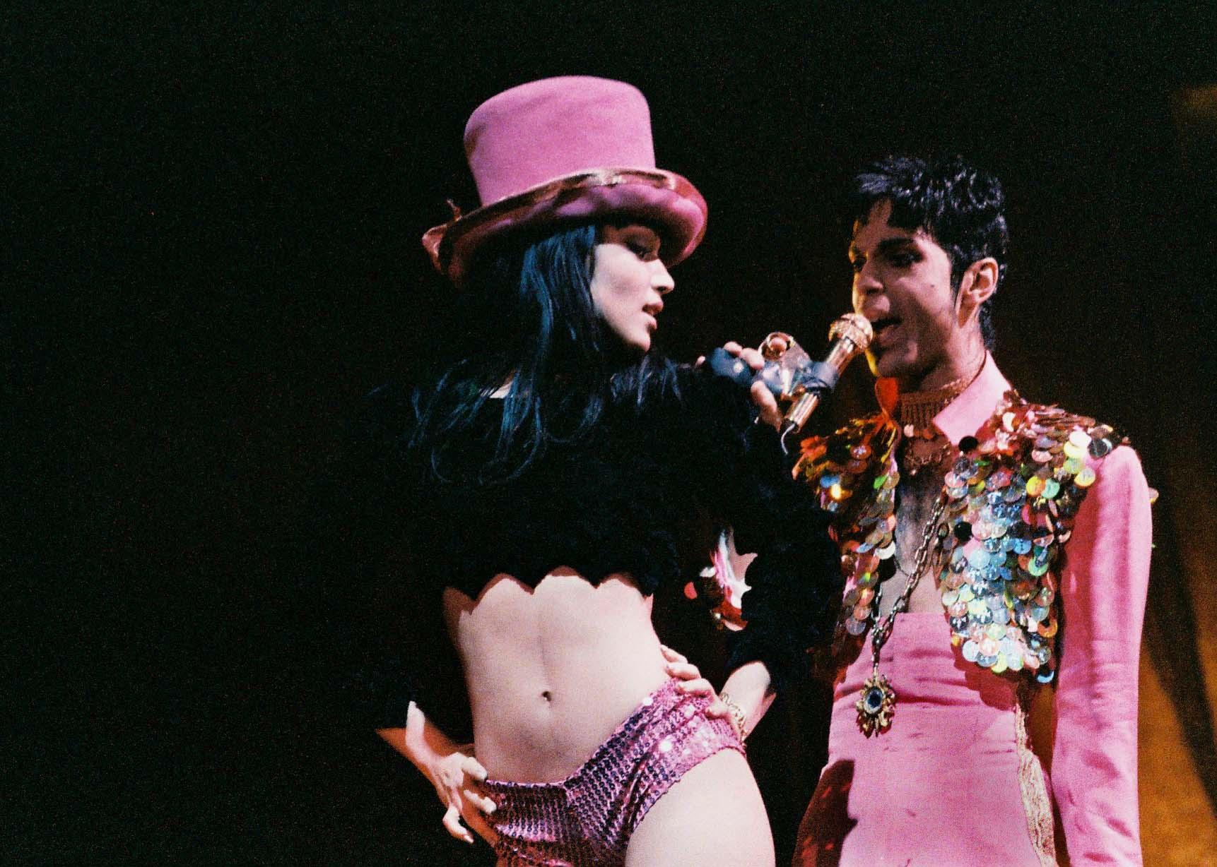 Mayte Garcia and Prince perform onstage on The Ultimate Live Experience tour.