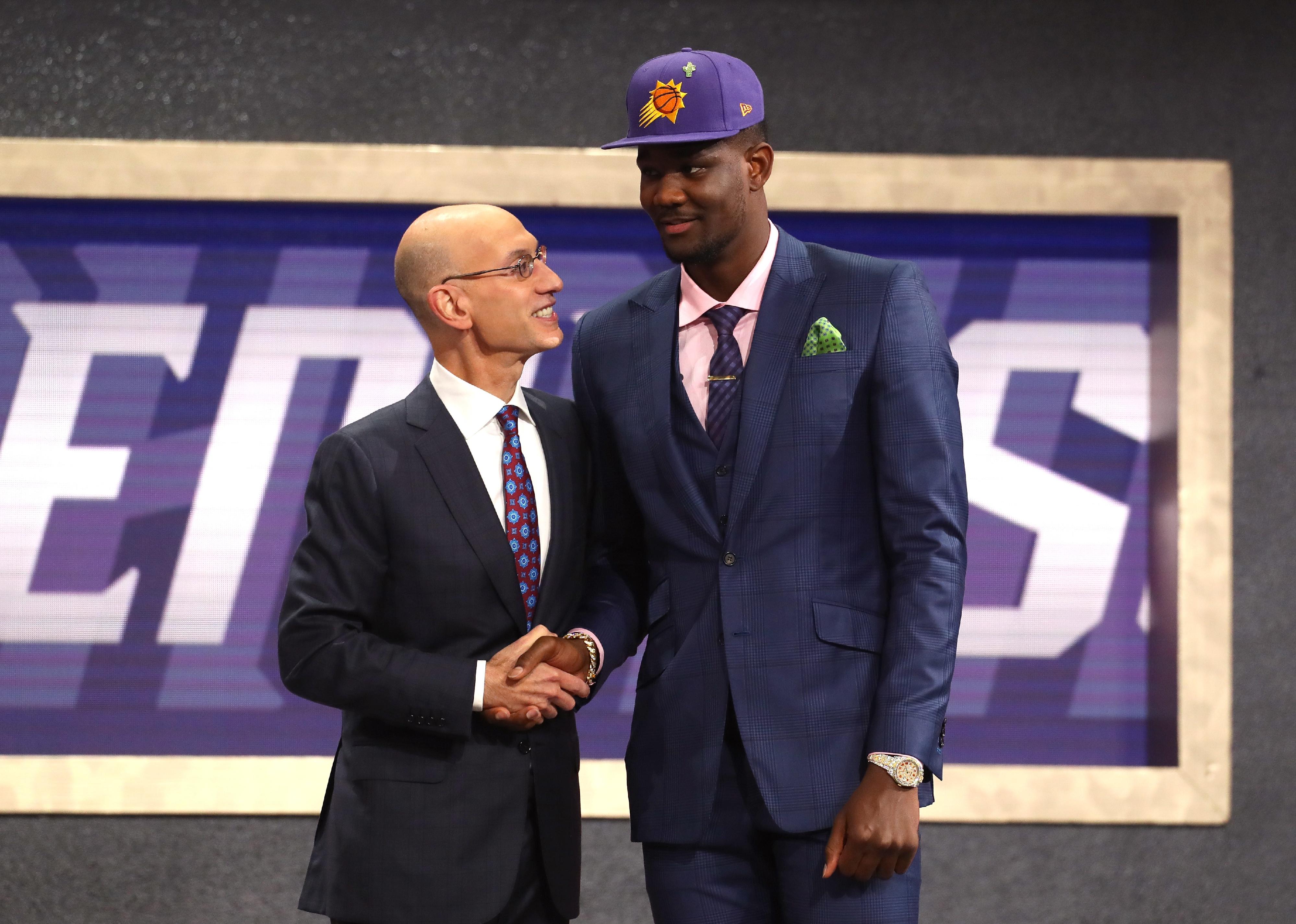 Deandre Ayton with NBA Commissioner Adam Silver after being drafted.