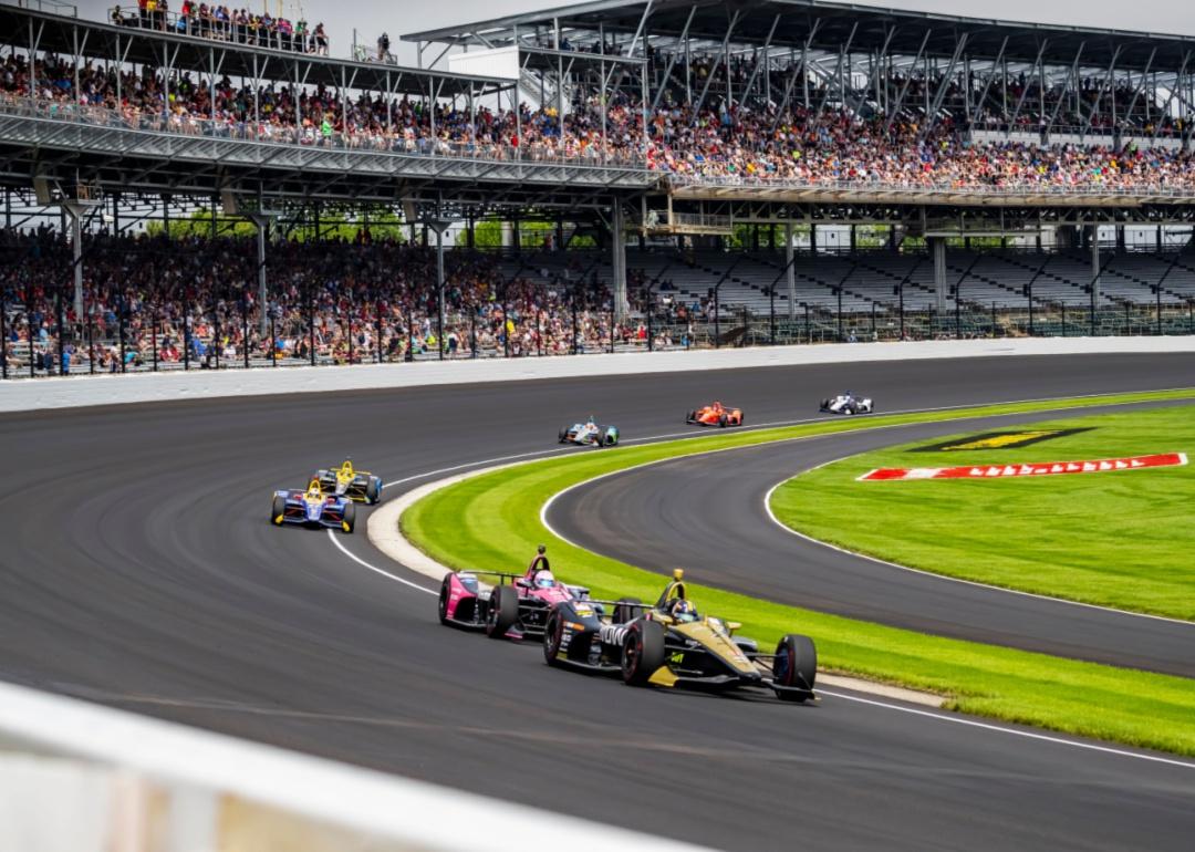 A crowded stadium during a race at Indianapolis Motor Speedway.