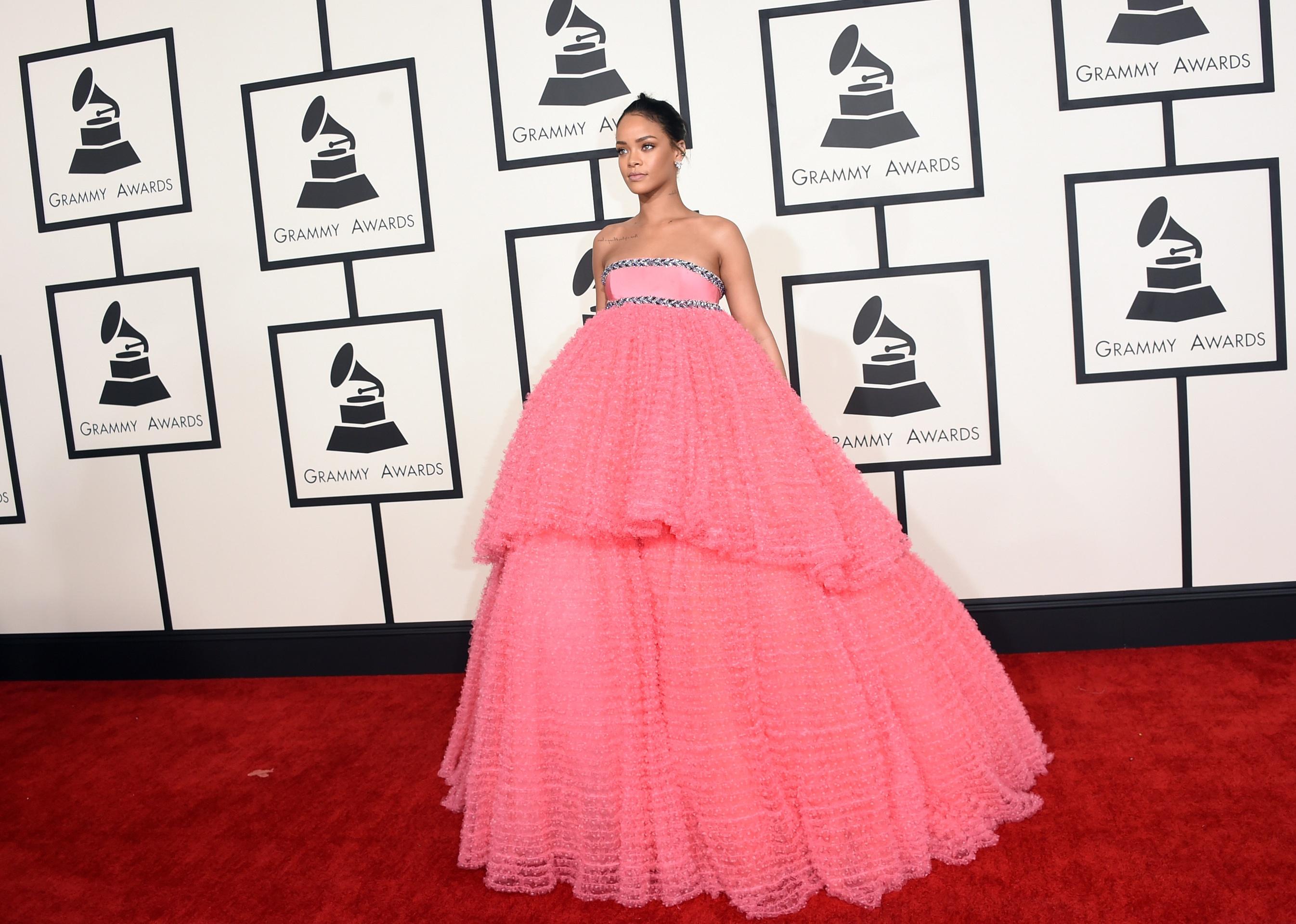 Rihanna in a bubble gum pink strapless gown with ruffles.