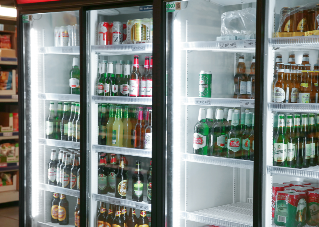 A variety of beers in a refrigerator in a supermarket