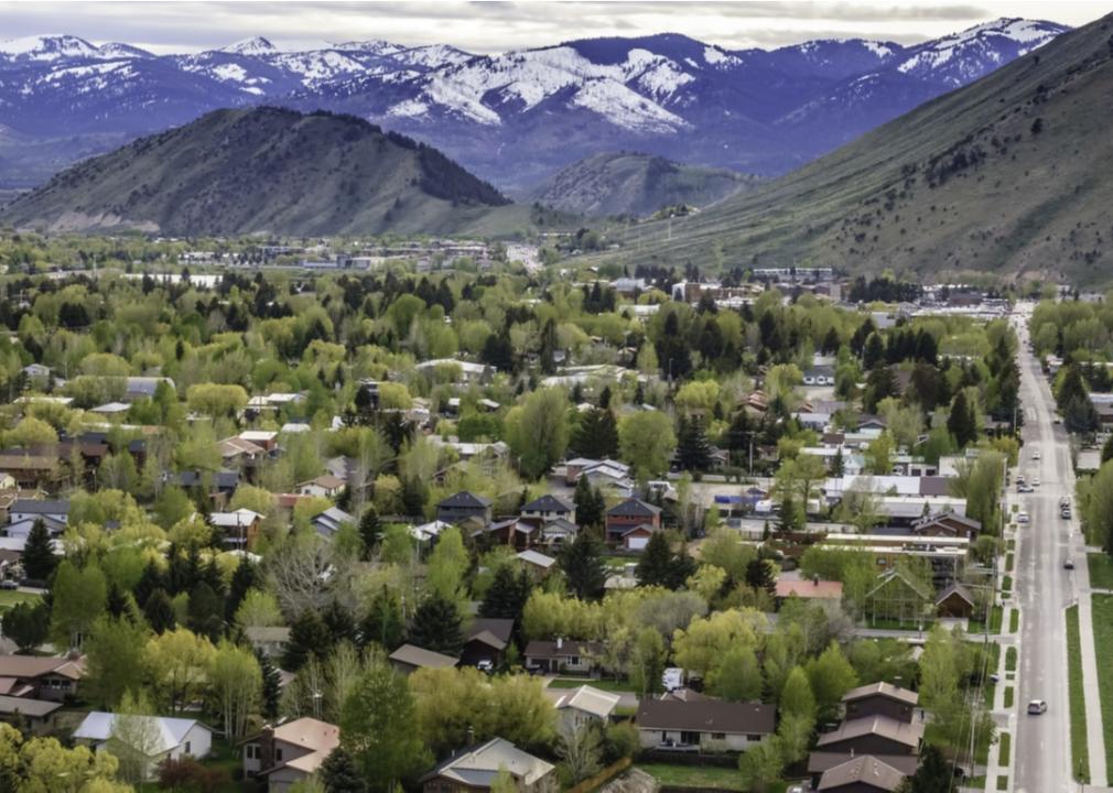 Aerial view of homes in Jackson, Wyoming with mountains in background.