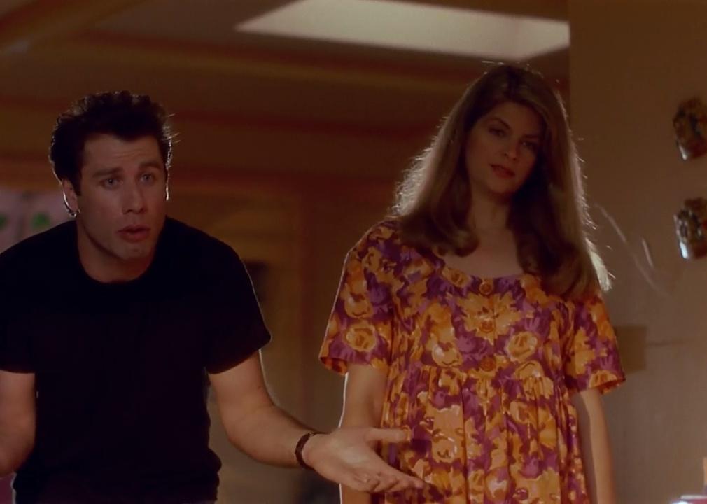 John Travolta and Kirstie Alley looking inquisitively.