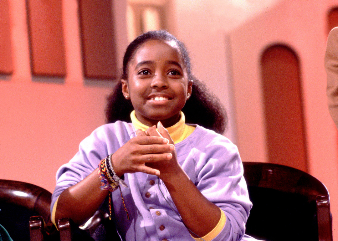 Young Keshia Knight Pulliam wearing a purple sweater as Rudy Huxtable.