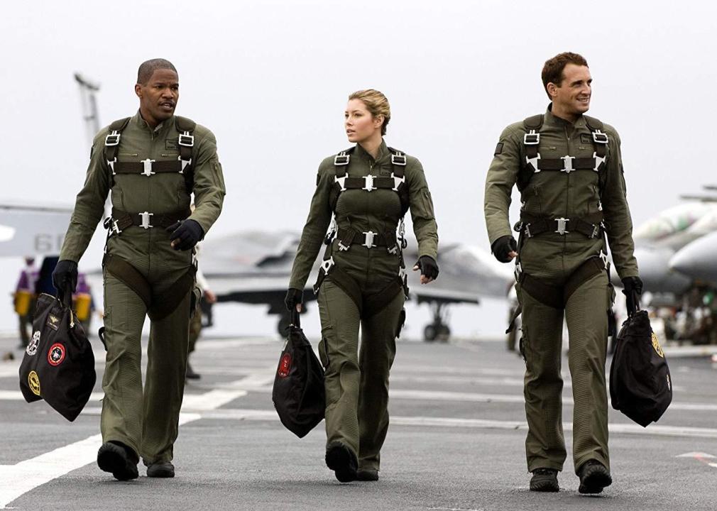 Jamie Foxx and Jessica Biel wearing fighter pilot gear.