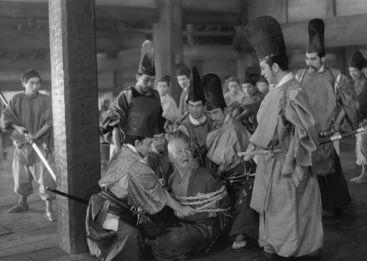 Actors tie up a man in a scene from 'Sansho the Bailiff.'