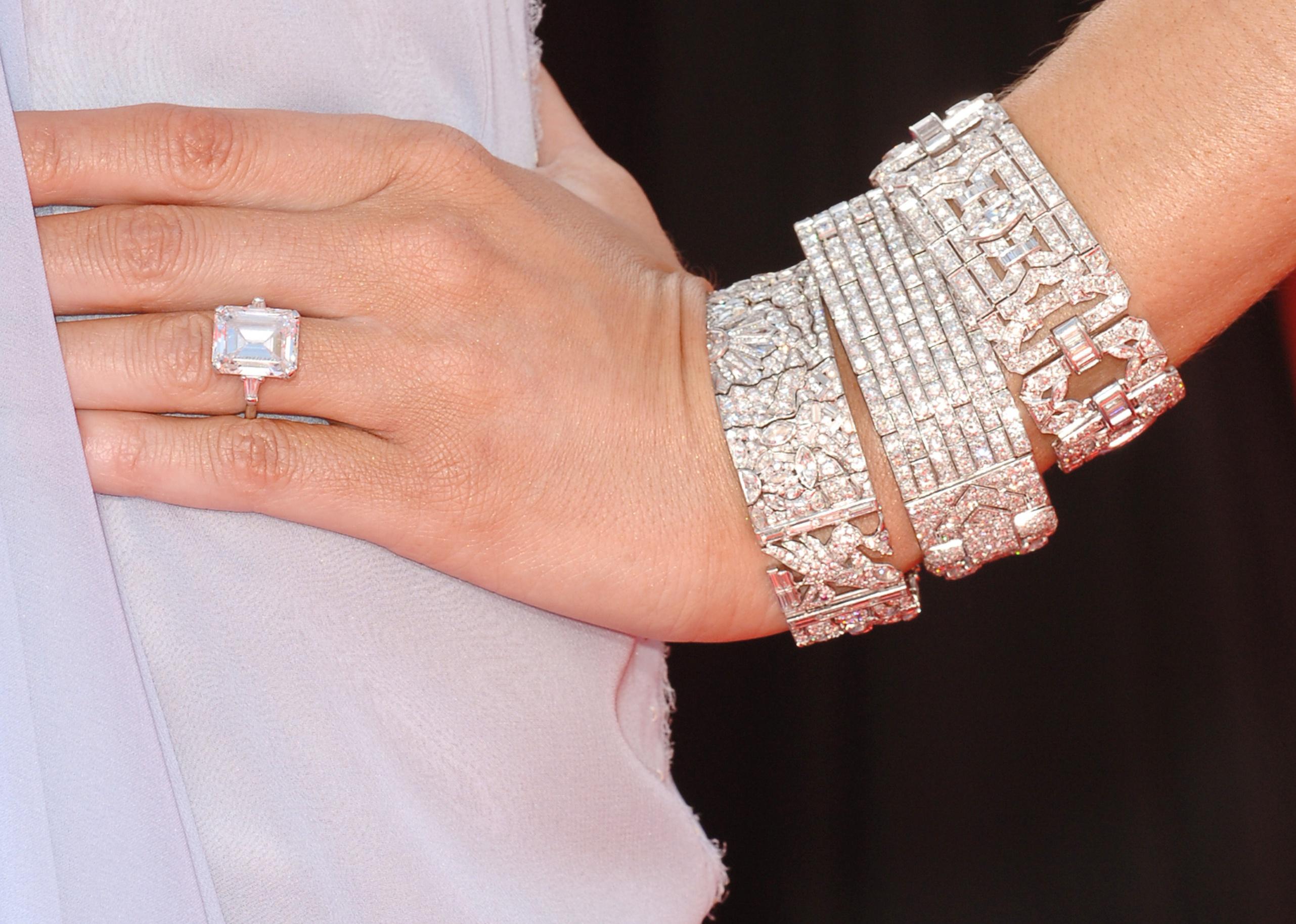 A close-up of Melania Trump's hand with engagement ring and diamond bracelets.