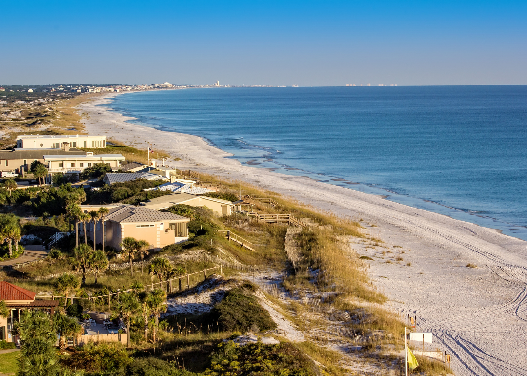 An aerial view of homes along a beach.