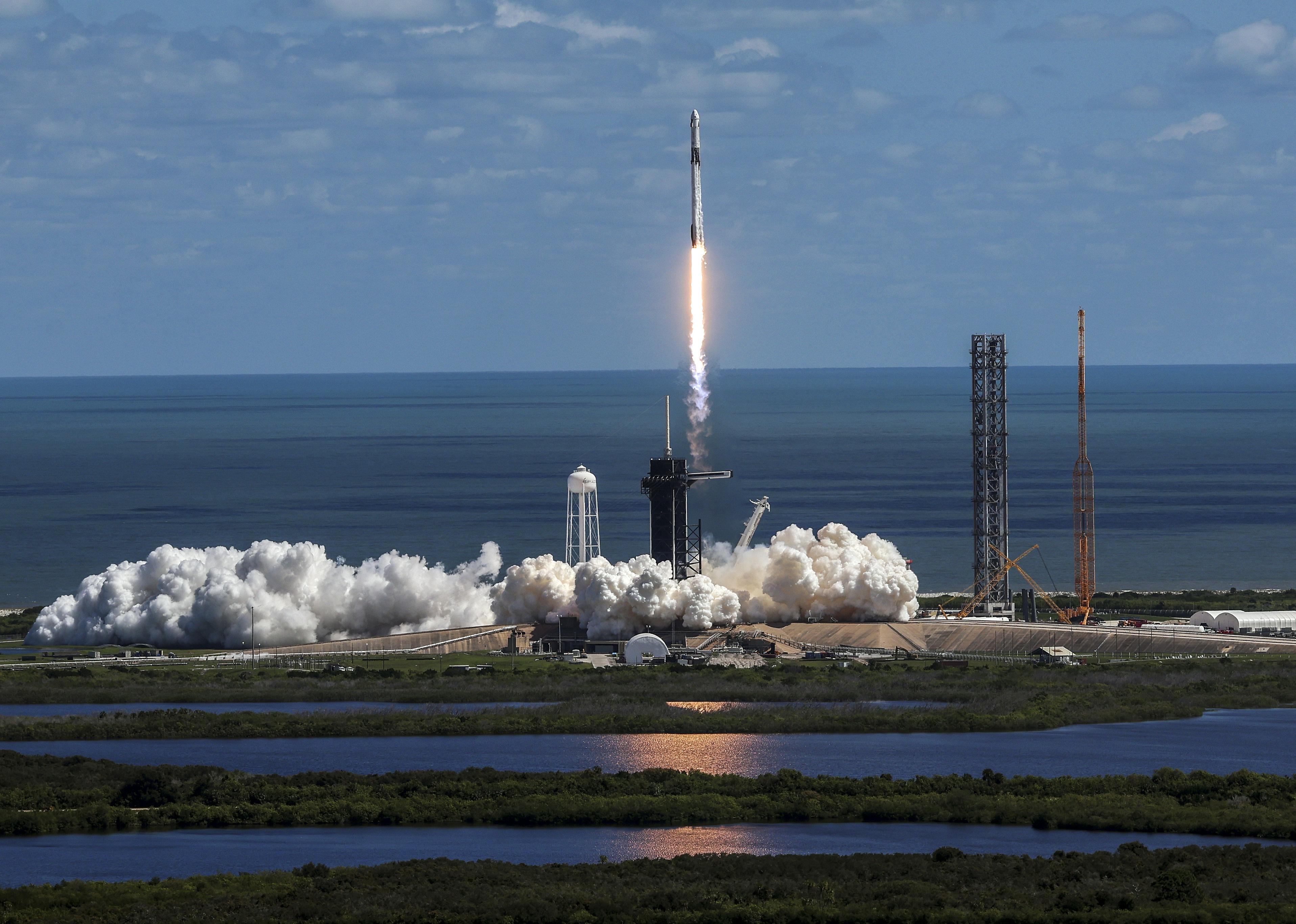 SpaceX’s Falcon 9 rocket with the Dragon spacecraft atop takes off at NASA's Kennedy Space Center in Cape Canaveral, Florida.
