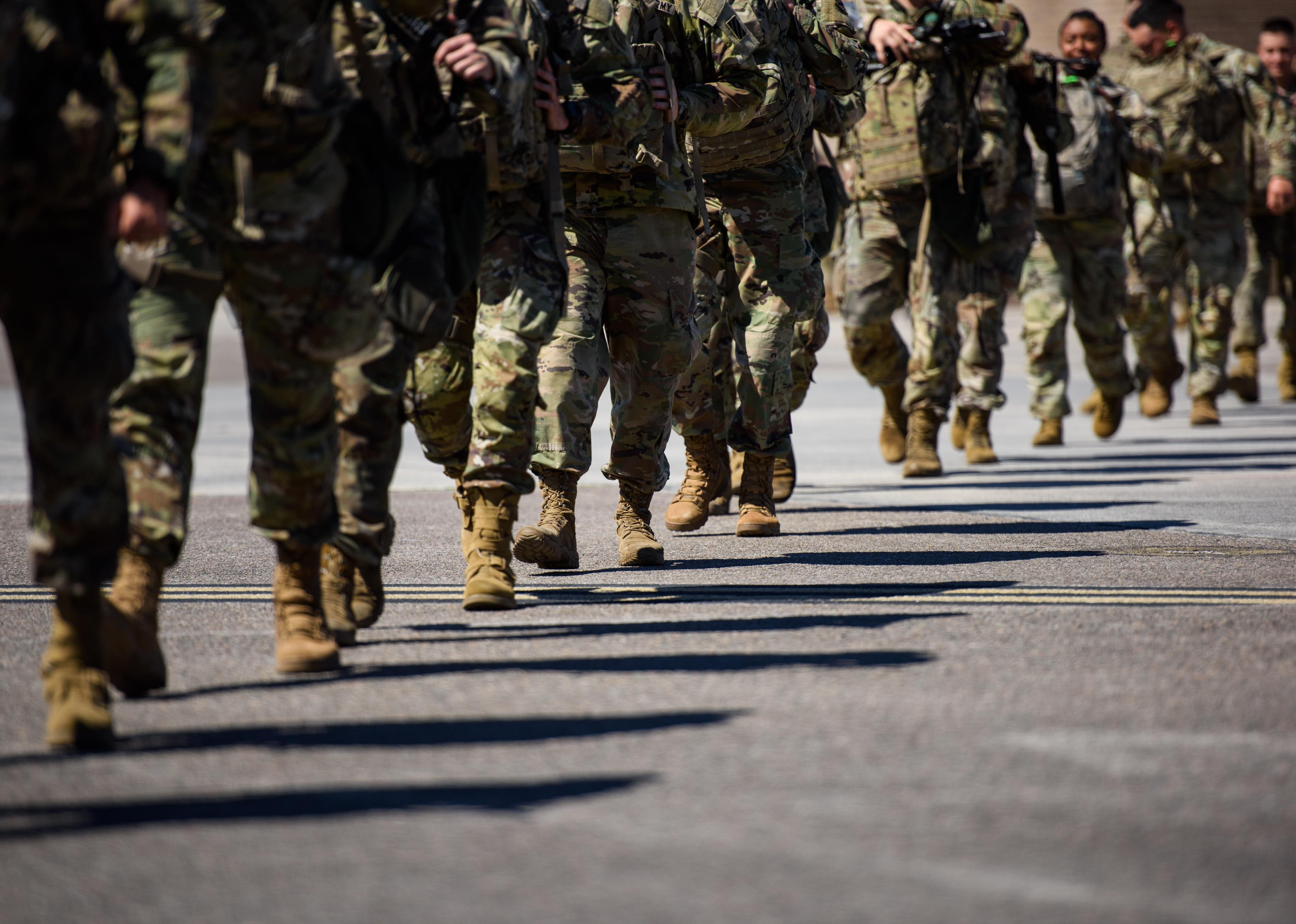 U.S. Army soldiers walking in a line.