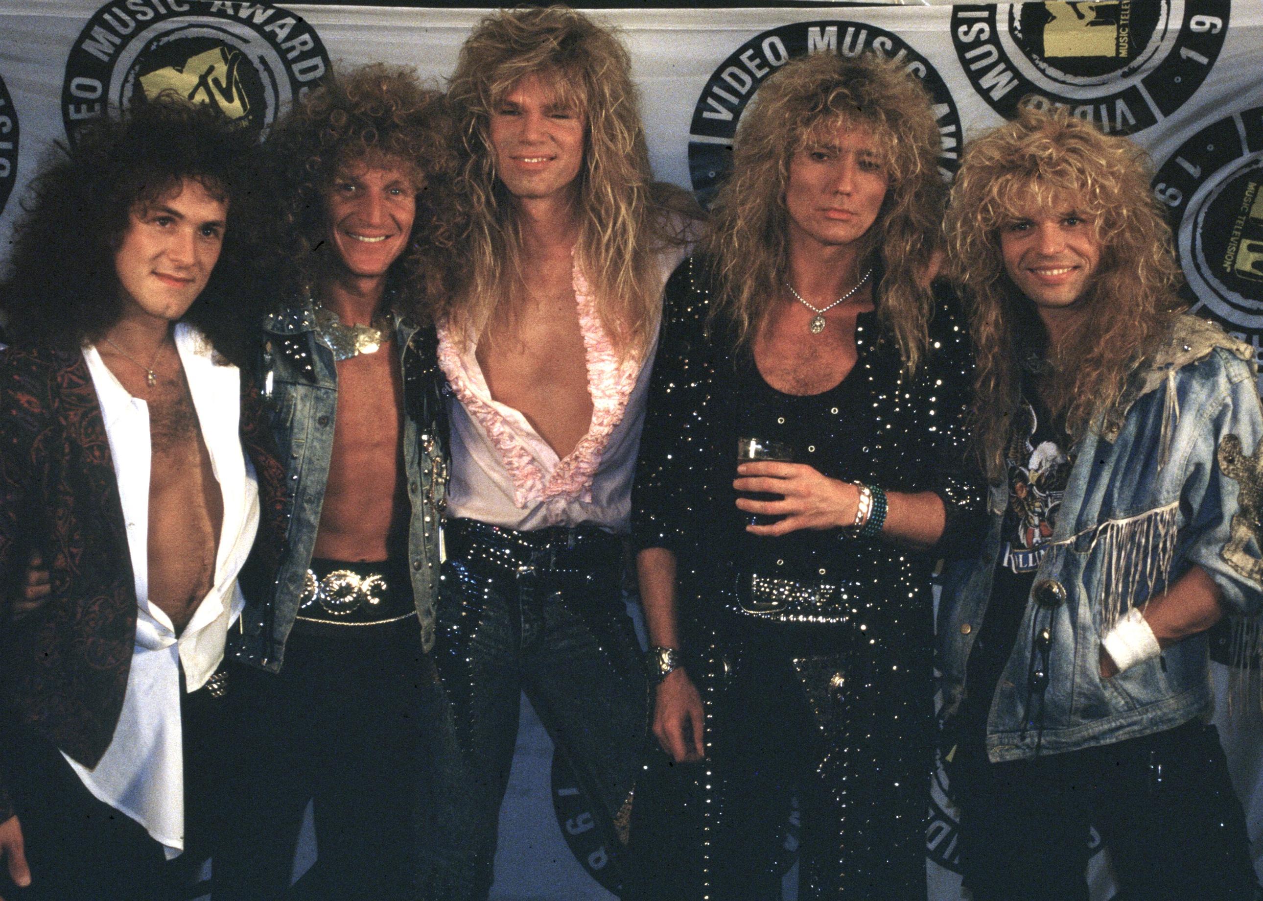 Whitesnake posing for a picture.