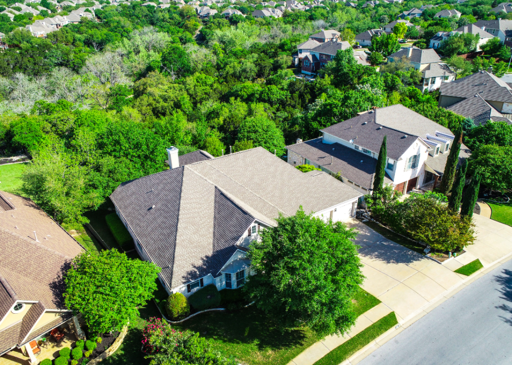 Large Austin, Texas homes surrounded by lush greenery.