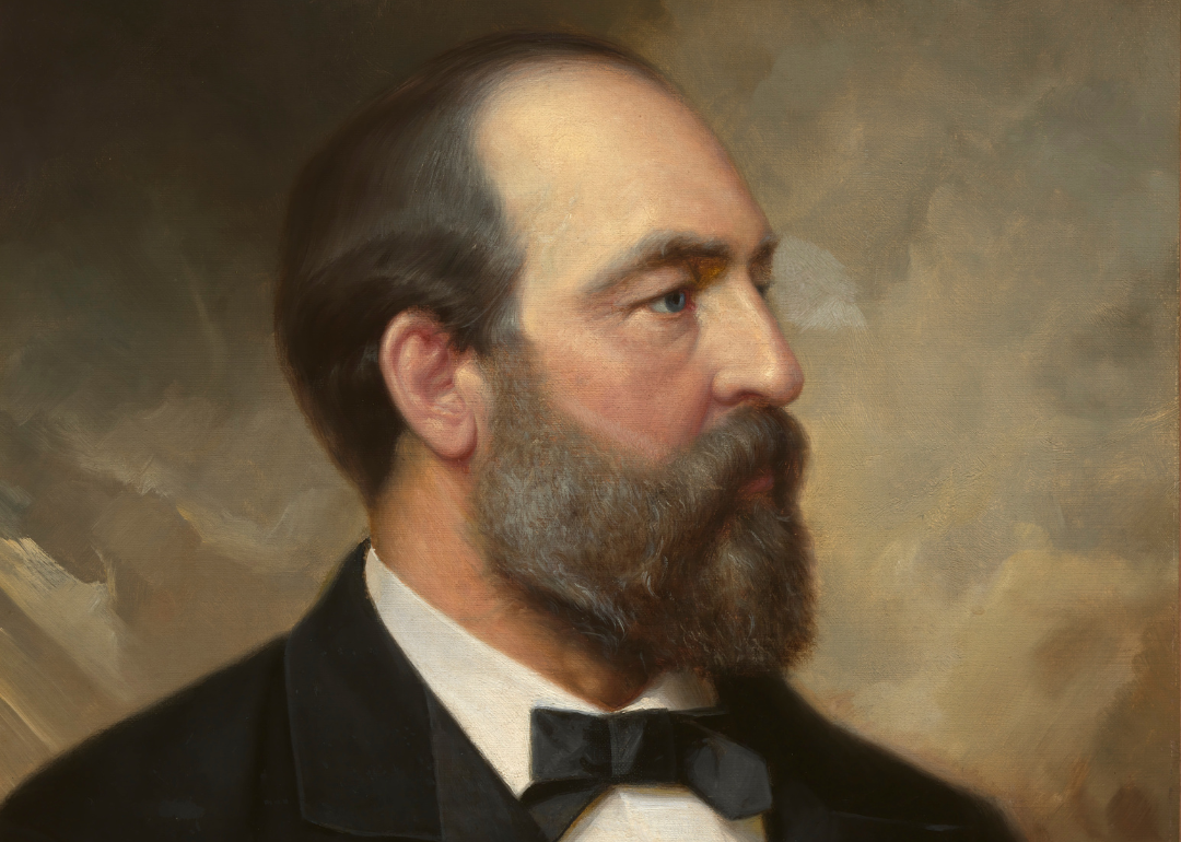 A painting of James A. Garfield in a dark suit and bowtie.