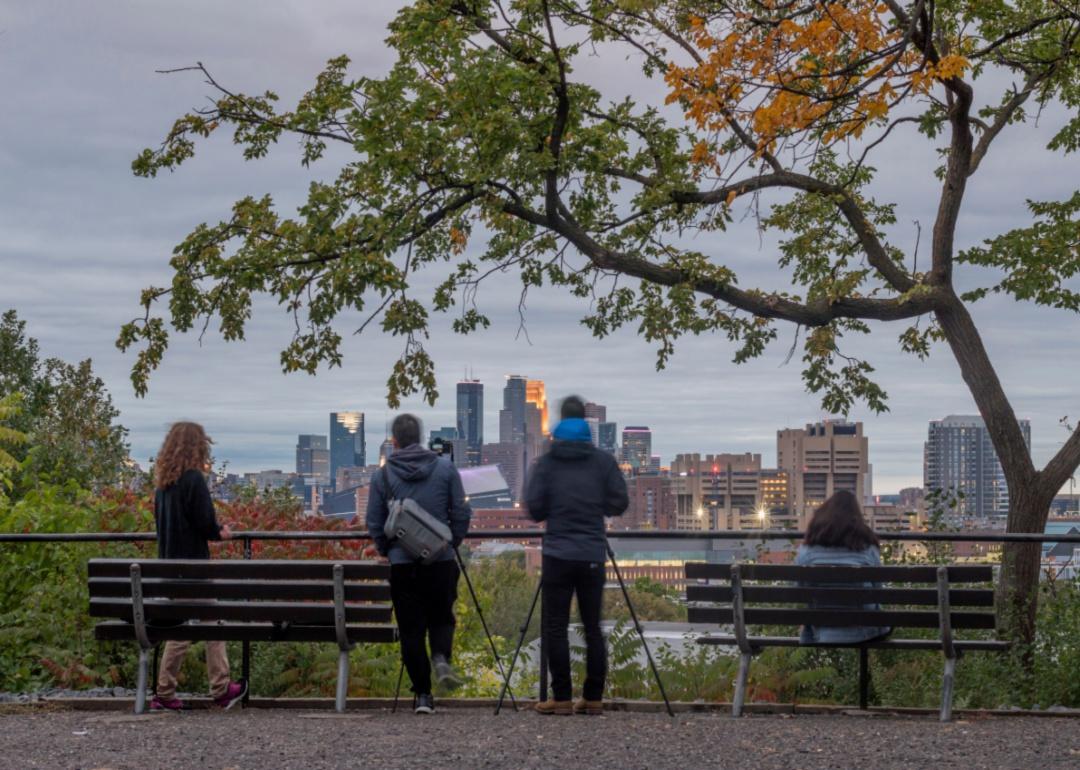 Photographers set up to shoot the Minneapolis skylie at twilight.