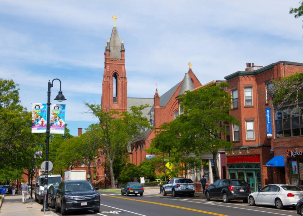 Historic red brick buildings and a church.