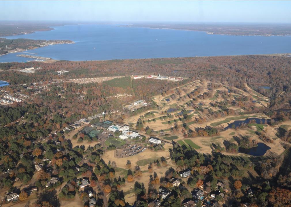 Aerial view of Pearl River and Ross Barnett Reservoir with autumn trees in Jackson, Mississippi.