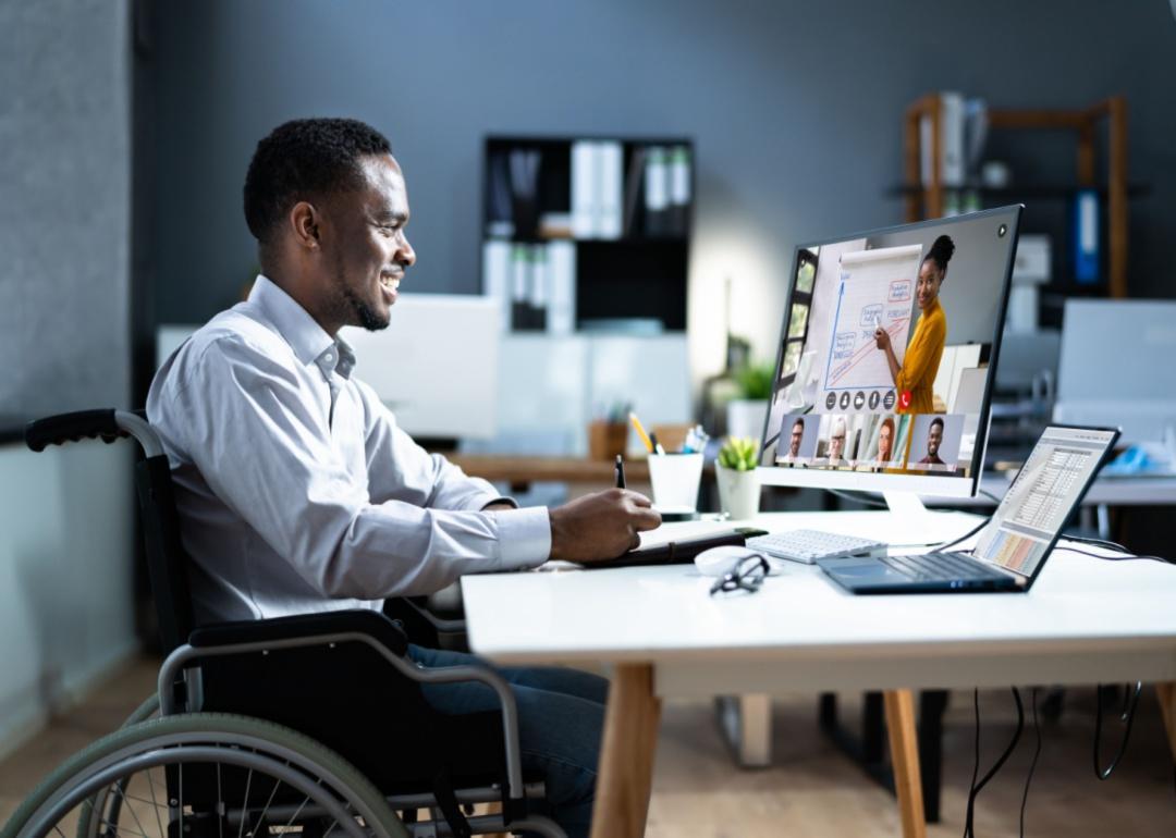 A man in a wheelchair attending a virtual training.