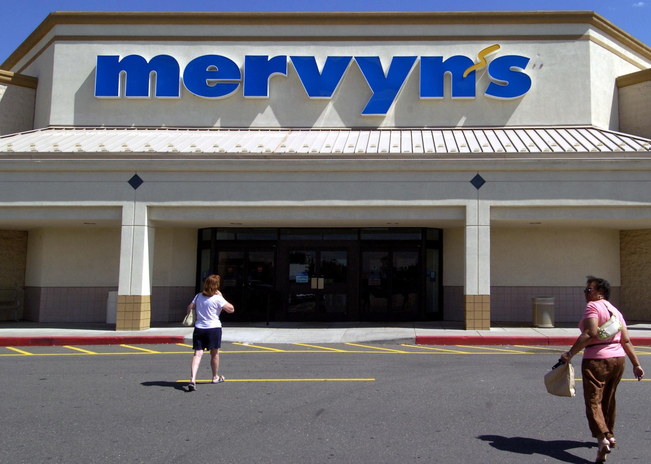 Two women walking into a Mervyn's store.