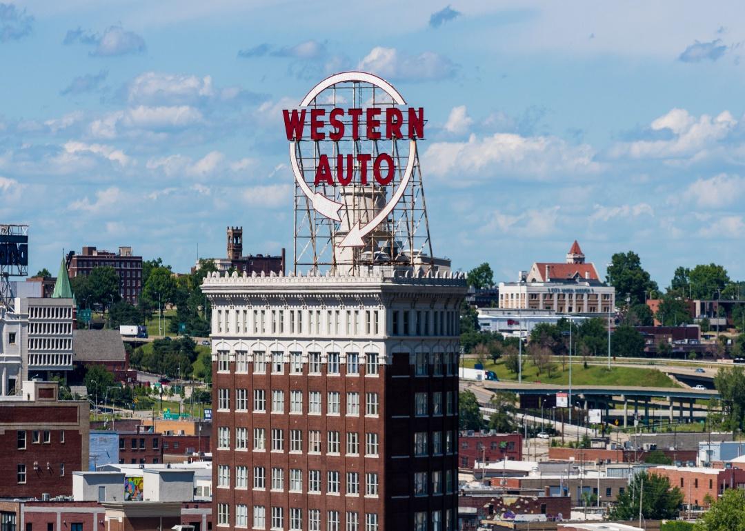 An aerial view of the Kansas City skyline with the Western Auto building on a sunny day.