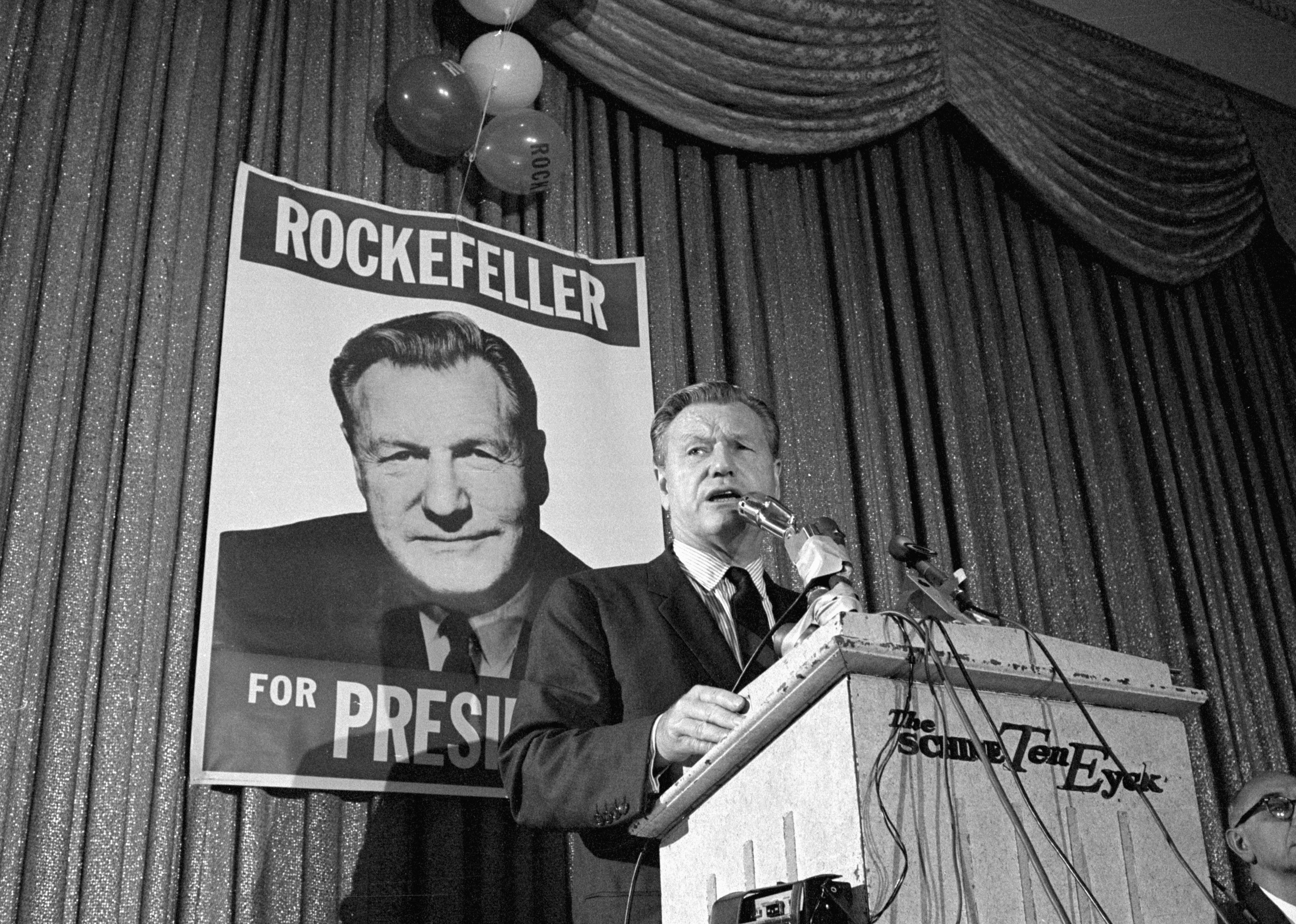 Nelson Rockefeller giving a campaign speech onstage.
