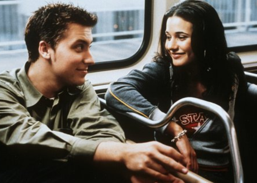 Lance Bass and a woman talk on the train together.