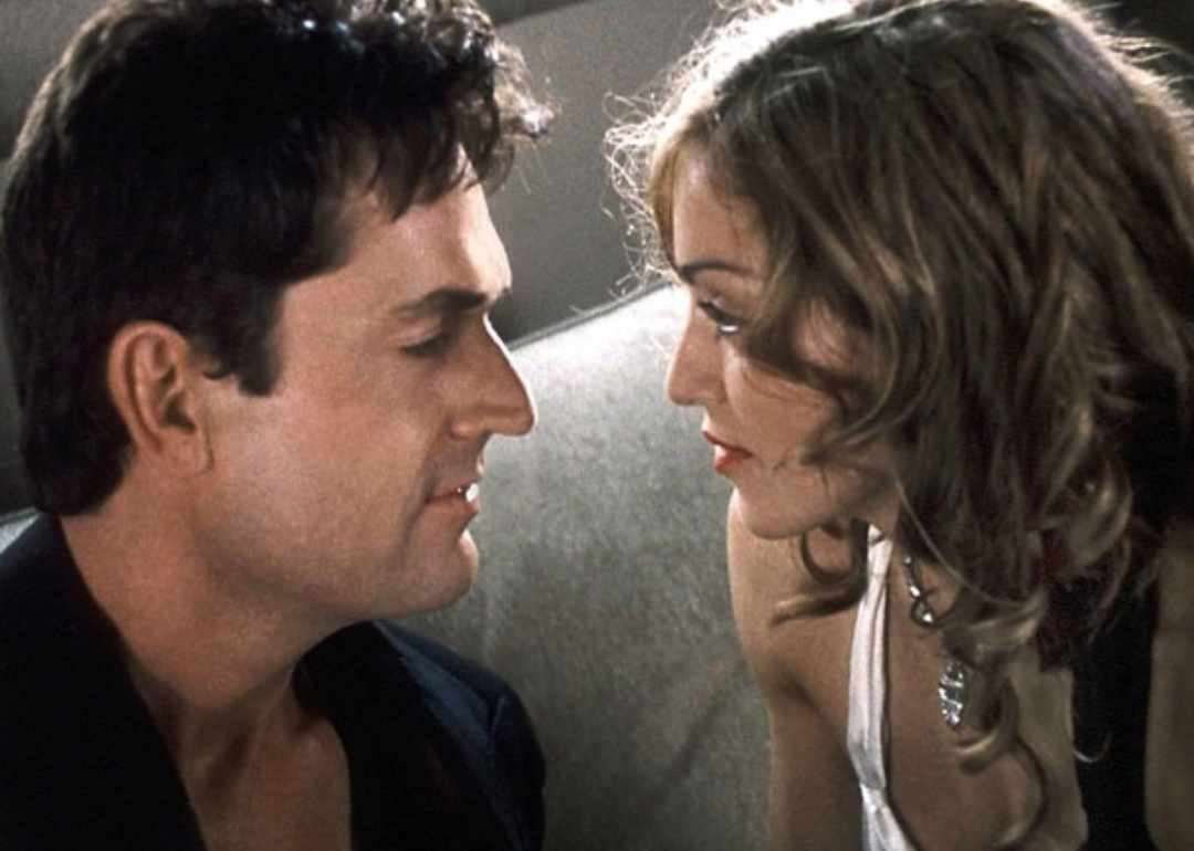 Madonna and Rupert Everett stare into each other's eyes.