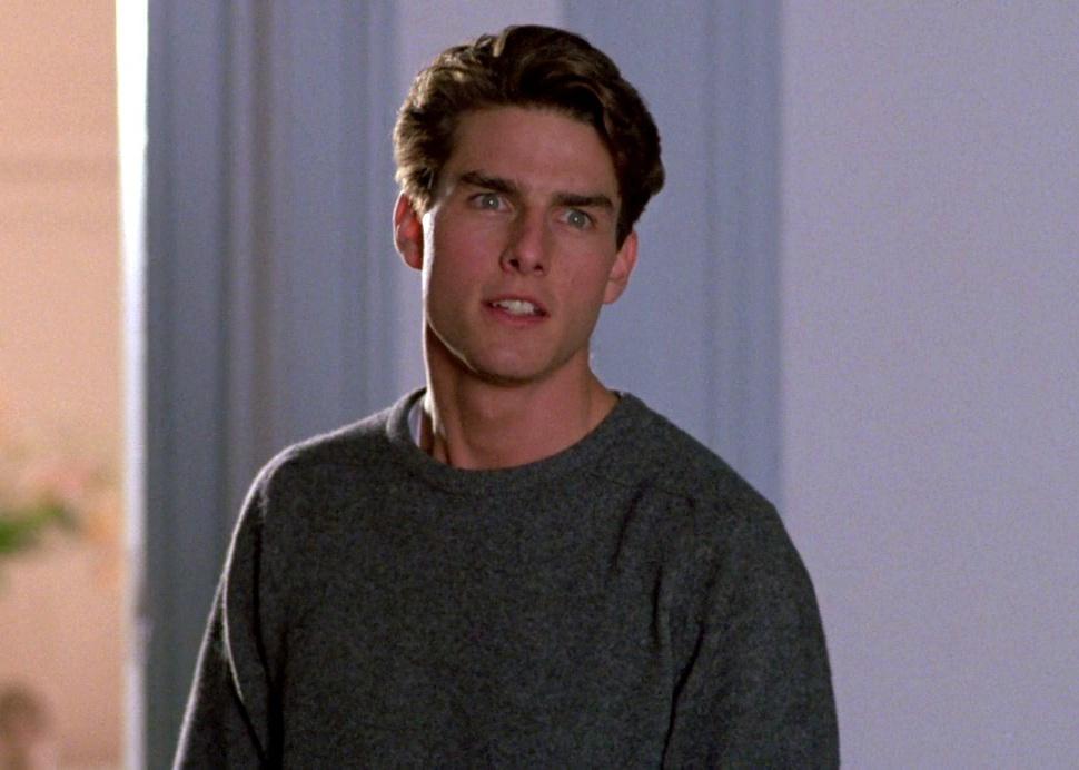 Tom Cruise in a gray sweater.