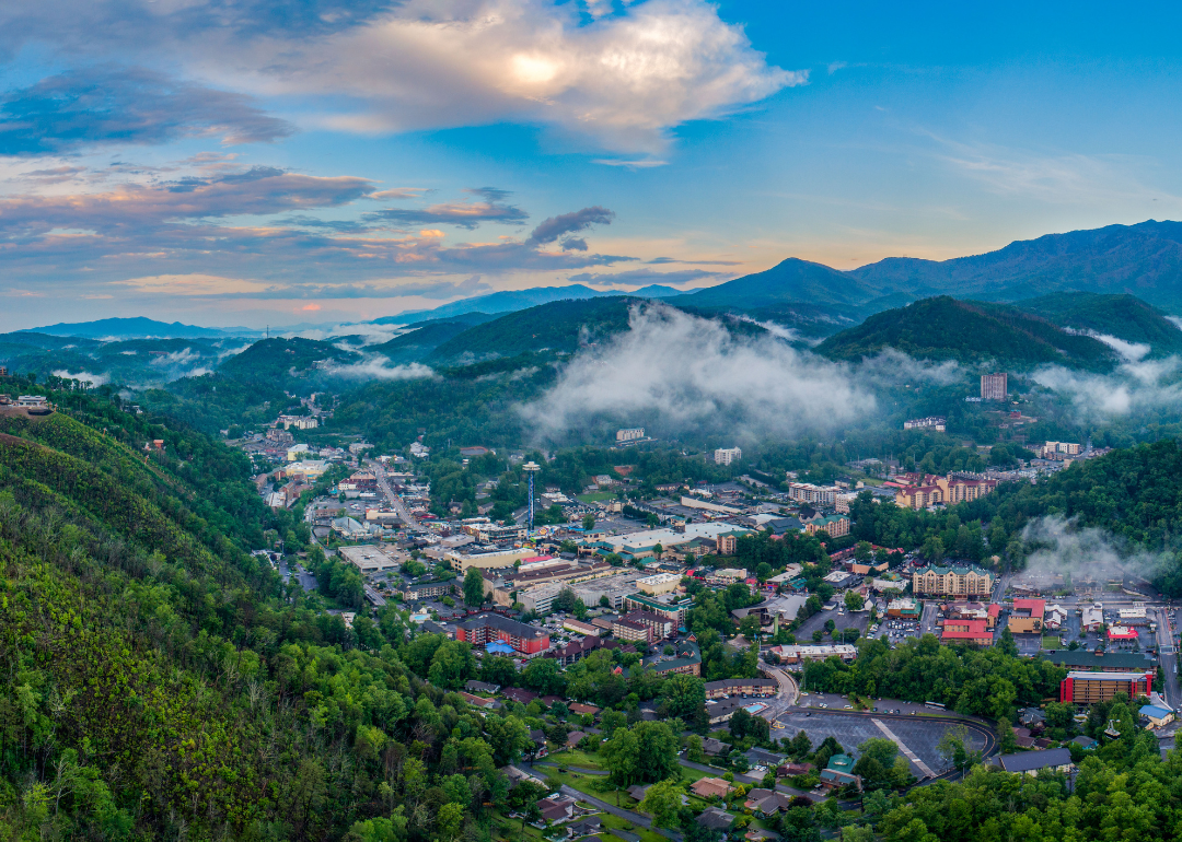 Aerial view of Downtown Gatlinburg in a green valley.