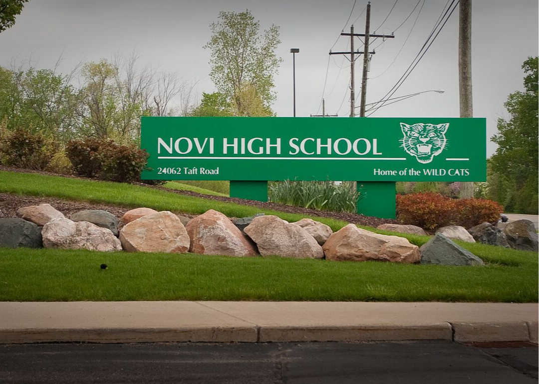 A green Novi High School sign.