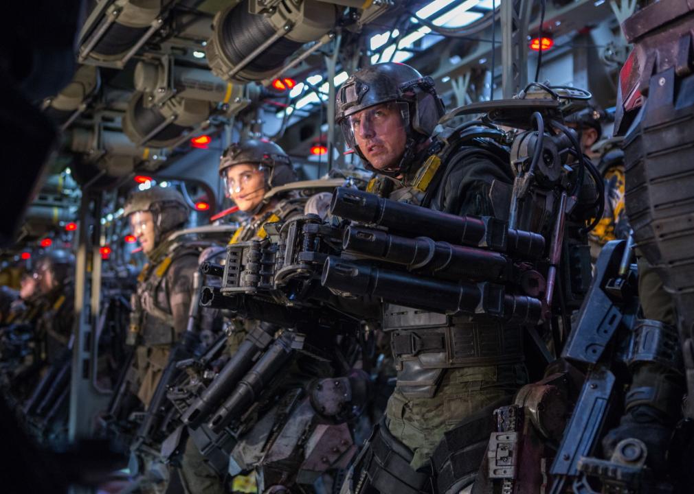 Tom Cruise and other characters are suited up to fight aliens.