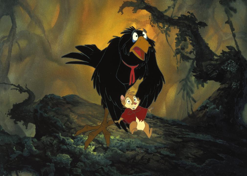 A cartoon of a black crow cradling a small chipmunk in a cloak.