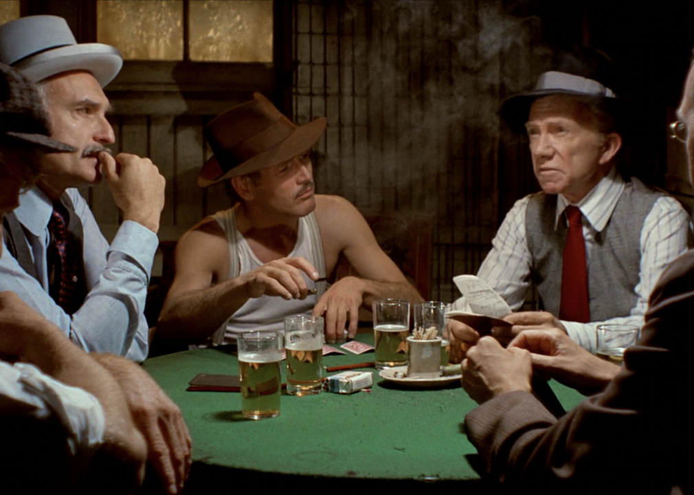 Paul Newman and others around a poker table in a scene from "The Sting"
