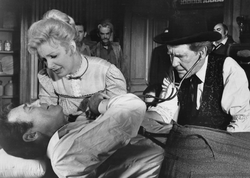 Henry Fonda, Burgess Meredith, and Joanne Woodward in a scene from "A Big Hand for the Little Lady"