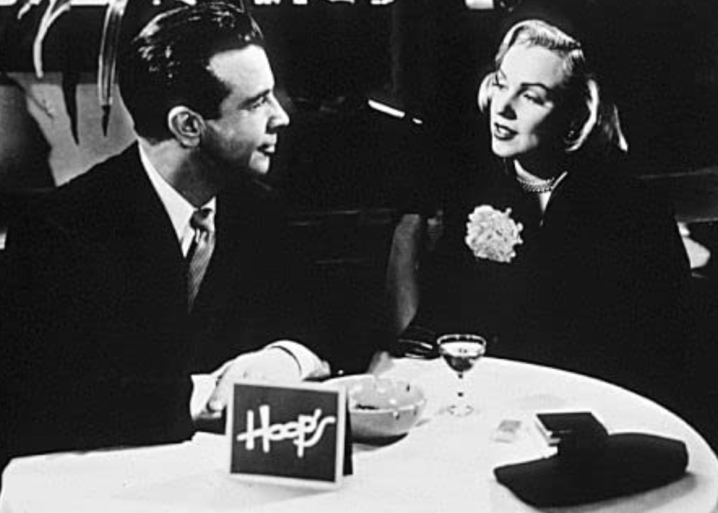 Marilyn Monroe and Dick Powell in a scene from "Right Cross" 