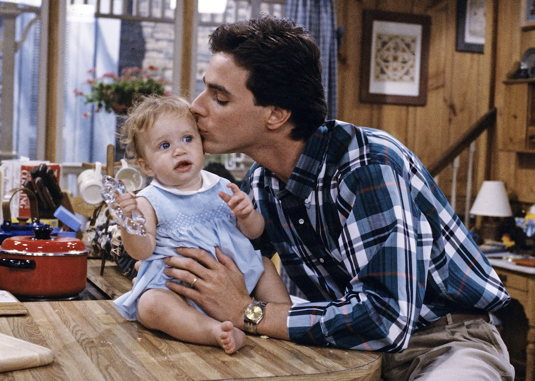 Mary-Kate Olsen and Bob Saget in a scene from "Full House".