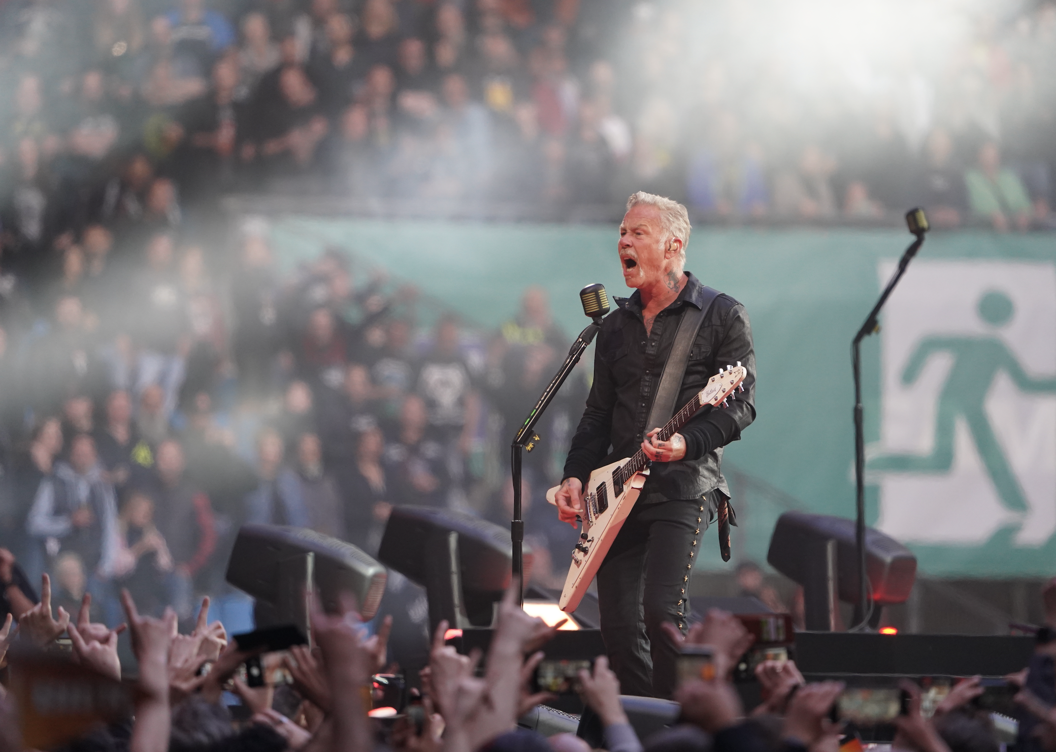 Singer James Hetfield of the band Metallica sings on stage at Volksparkstadion.