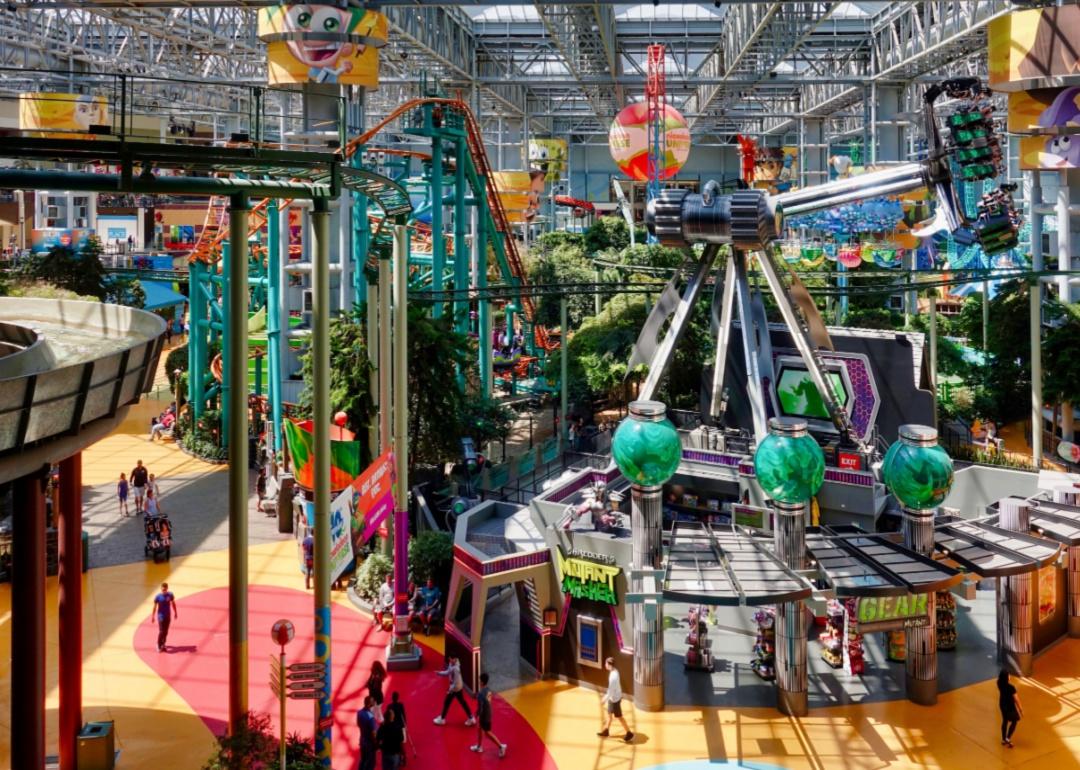 People and rides at the entertainment center at the Mall of America.