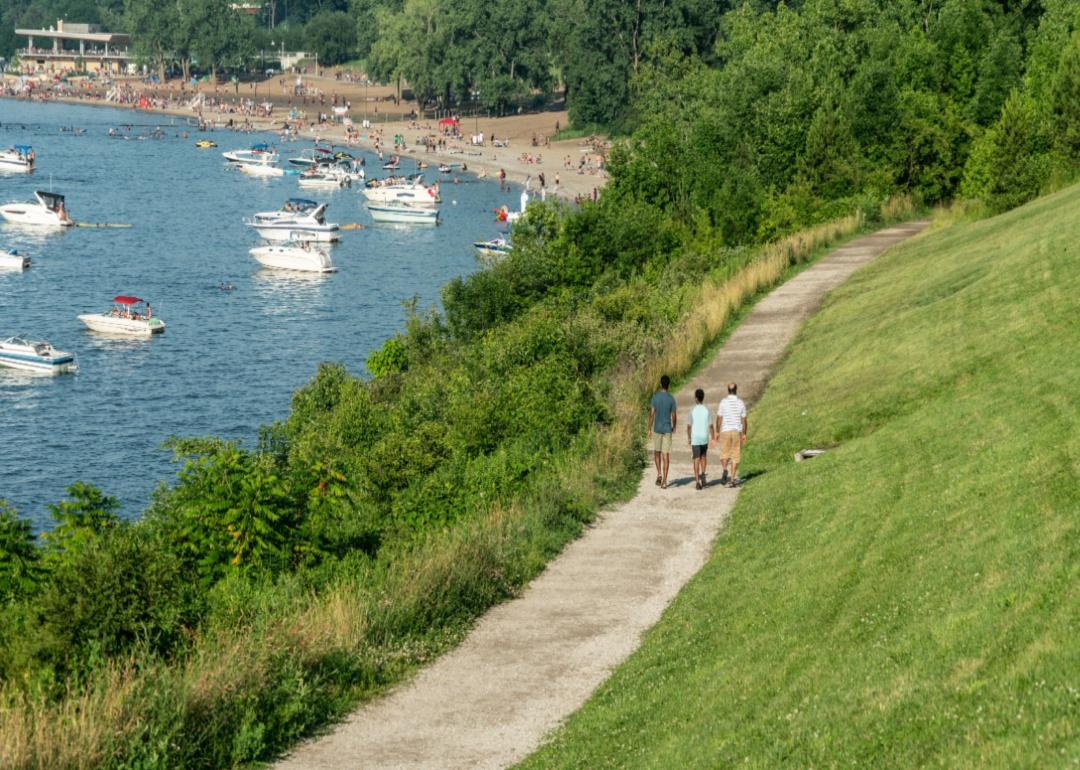 A family walking along the shore of Lake Erie.